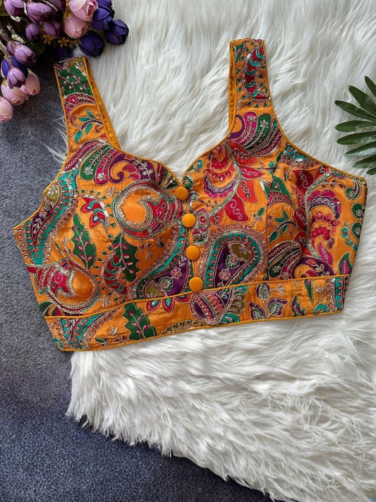 AMAB orange crepe blouse with multicolor paisley print, noodle straps, padded cups, and yellow button front. Sleeveless ethnic top.