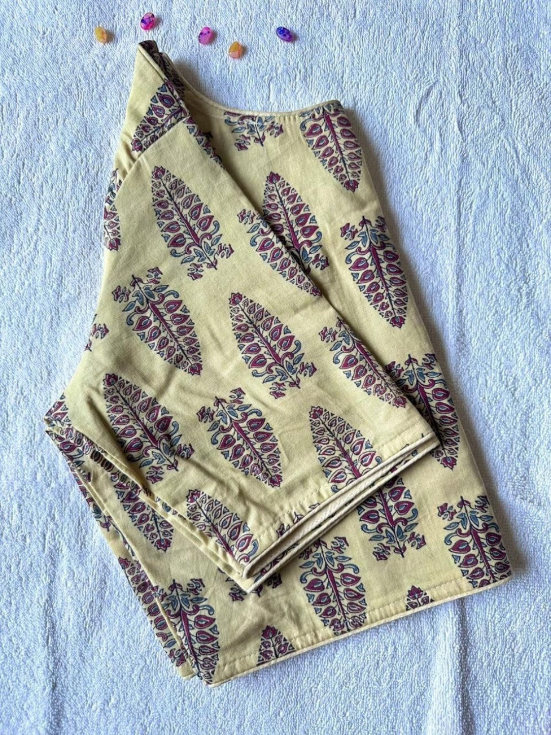 AMAB yellow cotton blouse with traditional Ajrakh handblock print, boat neck, princess cut, and front hook closure.