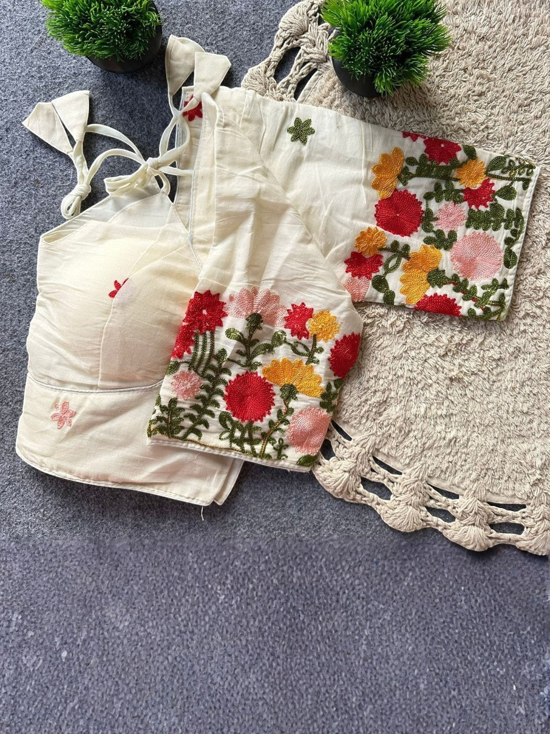 AMAB cream pure khadi cotton blouse with colorful floral embroidery and tie-back closure. Padded, partywear.
