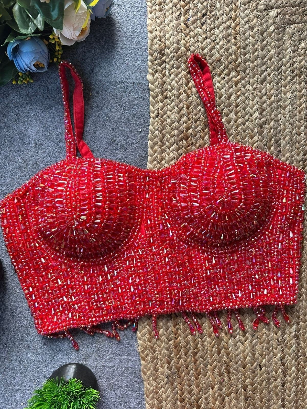 AMAB red sleeveless spaghetti blouse with heavy pearl and bead handwork, fringe hem, and padded cups. Ideal for parties.