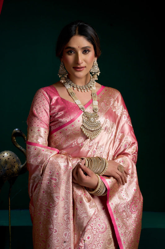 AMAB rose pink silk blend Banarasi saree with intricate zari weaving and contrasting pink border. Includes matching blouse.