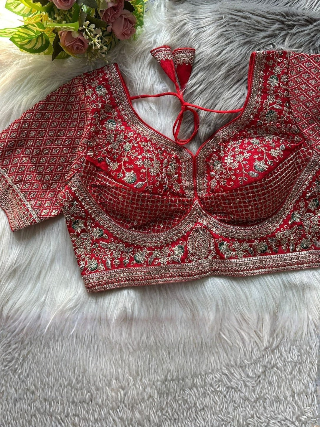 AMA B
Red Roman silk bridal blouse with gold zari & sequence embroidery. Sabyasachi inspired, back open design with latkans.