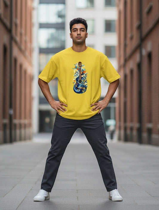 AMA B Unisex Classic Crew T-Shirt in yellow, 100% cotton, featuring a vibrant graphic of a blue guitar with floral and wave elements.