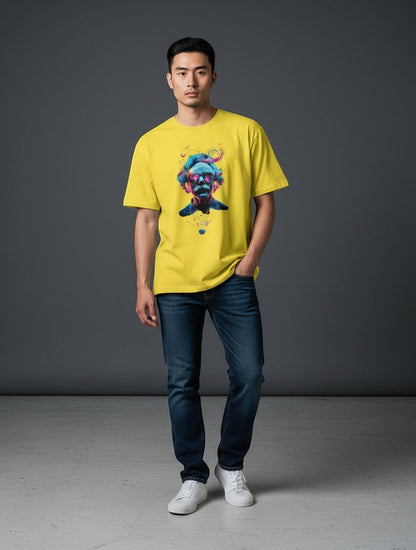 AMAB yellow cotton t-shirt with abstract portrait graphic and sunglasses. Model is wearing jeans and white sneakers.