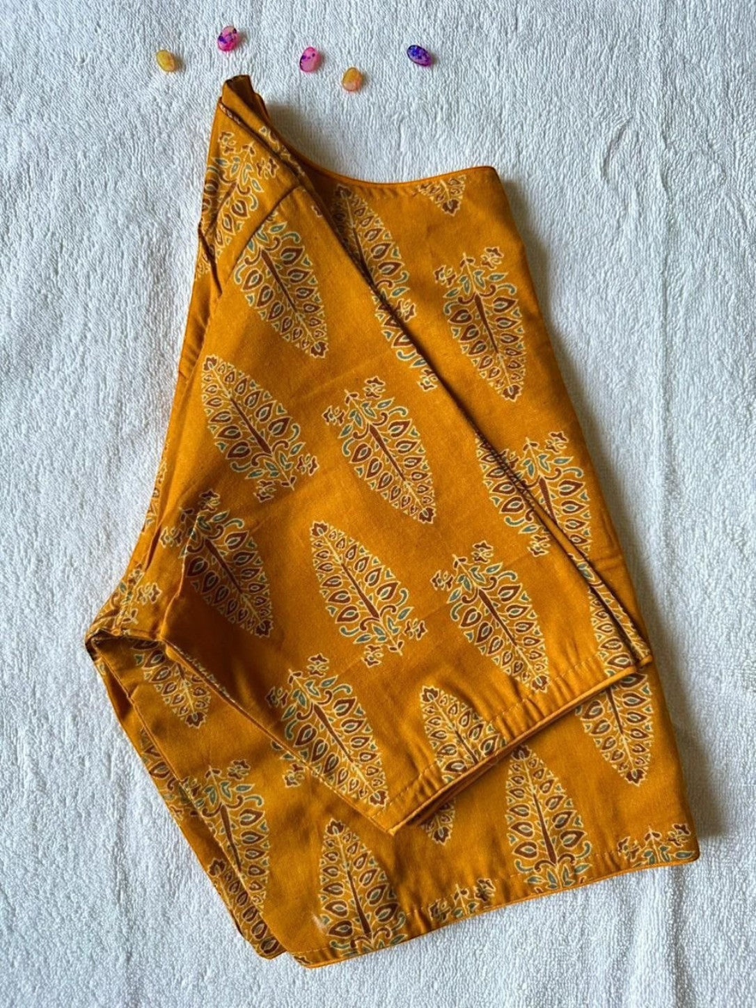 AMAB Pure Ajrakh handblock cotton blouse in mustard yellow with paisley print, boat neck, and elbow-length sleeves.