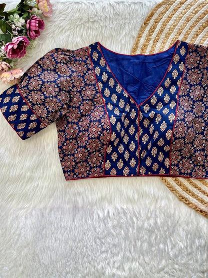 AMAB navy blue cotton blouse with puff sleeves, front open design, and intricate Ajrakh print. Features red trim.