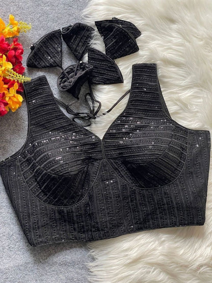 AMAB heavy black georgette partywear blouse with embroidery and sequence work, deep neck, padded, back open. Size 38".