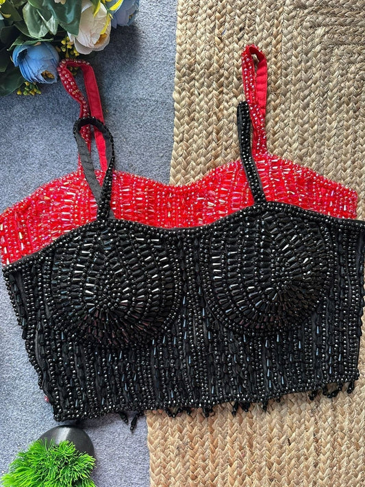 AMAB black sleeveless spaghetti blouse with heavy pearl and beadwork, red spaghetti straps. Back open design.