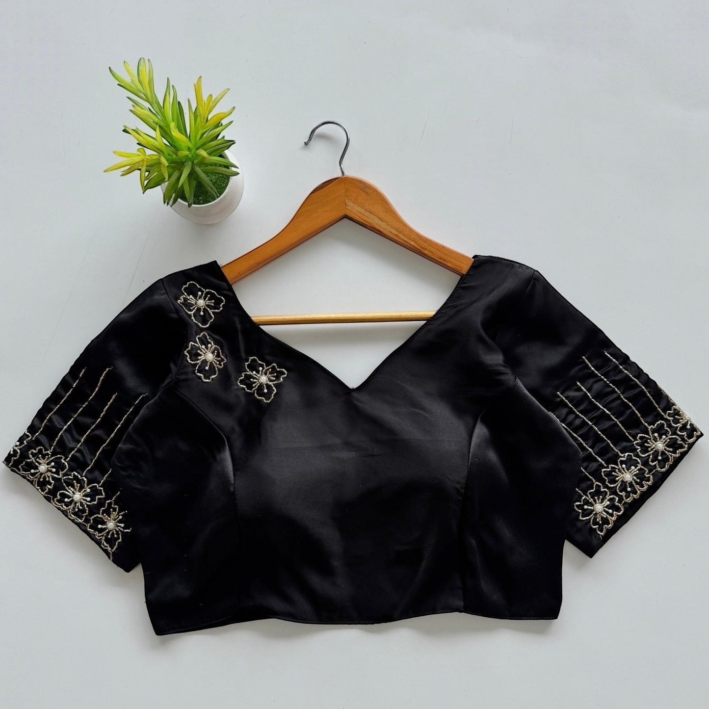 AMAB black Dilruba silk blouse with golden handwork floral embroidery on sleeves and neckline. Padded partywear.