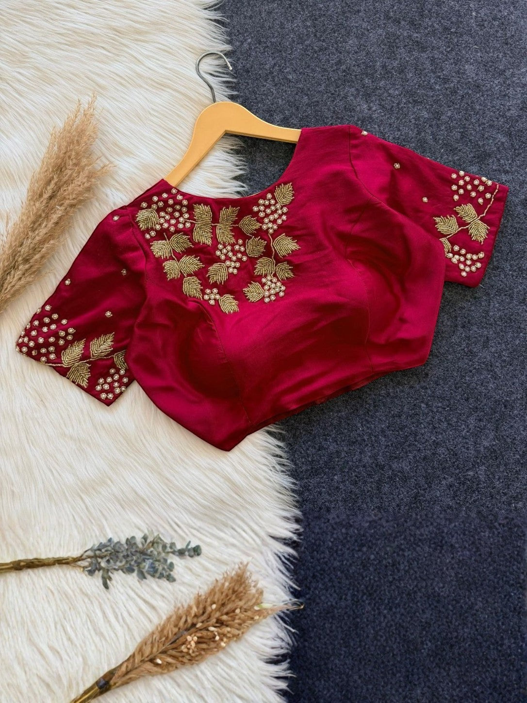 AMAB Bollywood Collection designer padded blouse in rich red silk with intricate gold handwork on the front and short sleeves.