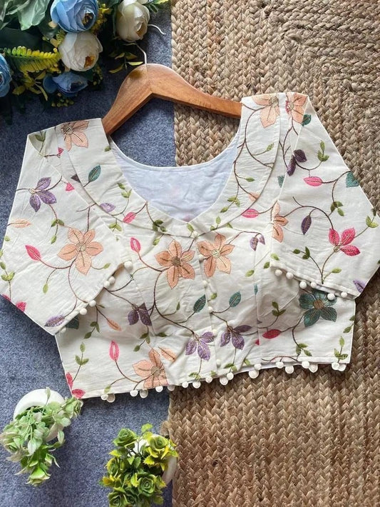 AMAB cream Camric cotton blouse with floral embroidery and sequence work, padded, with pom-pom trim.