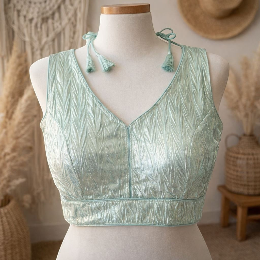 AMAB light mint green crush silk blouse with V-neck and tassel tie-up. Padded design.