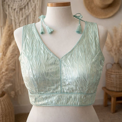 AMAB light mint green crush silk blouse with V-neck and tassel tie-up. Padded design.