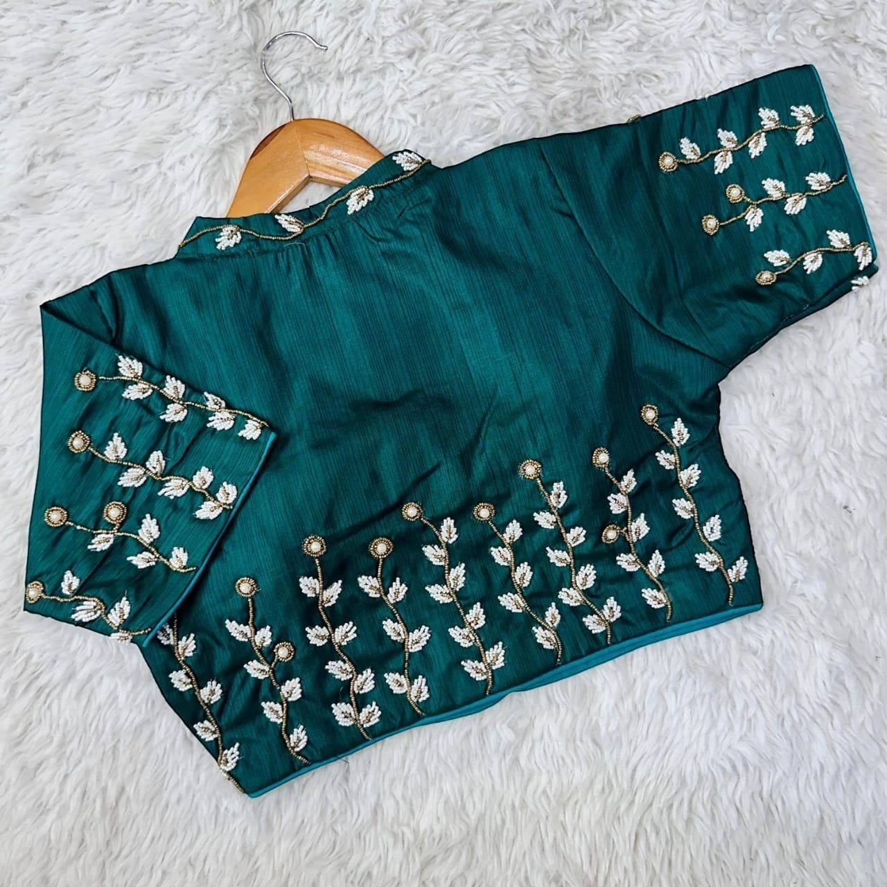 AMAB designer green silk blouse with handcrafted white floral embroidery and beaded collar. Padded fit, partywear.