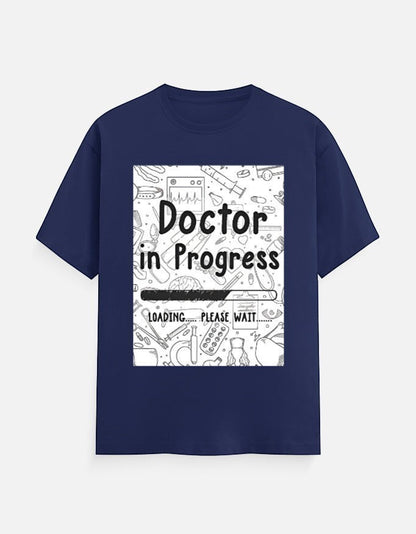 AMAB navy blue cotton t-shirt with "Doctor in Progress Loading Please Wait" graphic and medical icons.