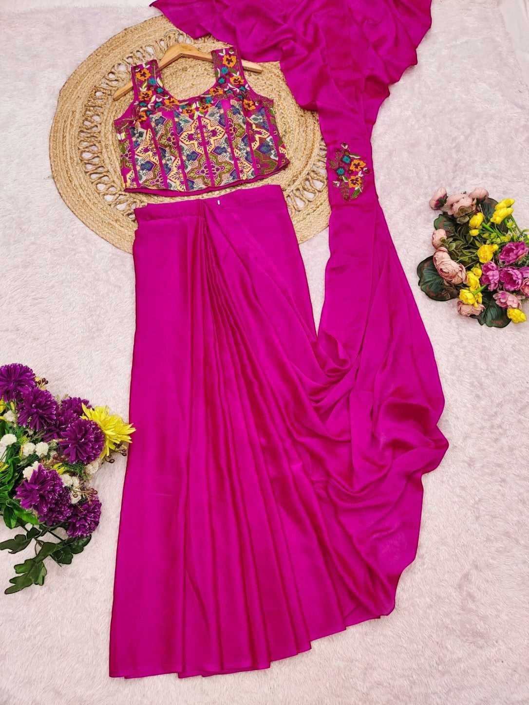 AMAB embroidered magenta crop top and drape skirt set with colorful floral embroidery. Sleeveless top and flowing skirt.