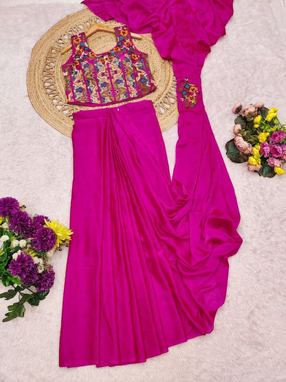 AMAB embroidered magenta crop top and drape skirt set with colorful floral embroidery. Sleeveless top and flowing skirt.