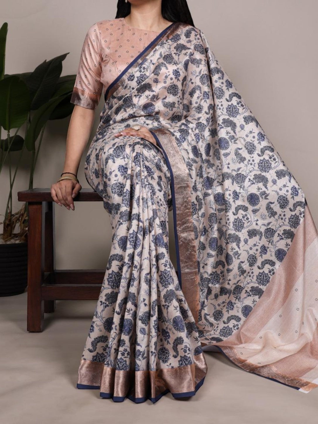AMAB floral print silk blend saree in cream with blue motifs and a contrasting navy border. Includes a blush pink blouse.