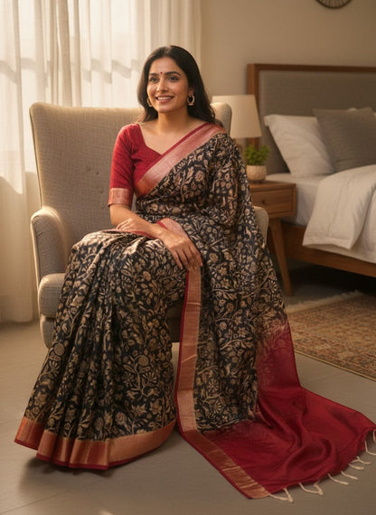 AMAB Floral Print Silk Blend Saree in black with gold floral motifs and a red border. Features a matching red blouse.