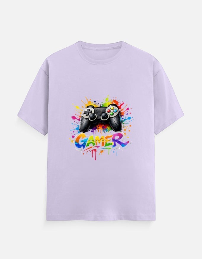 AMAB men's light purple cotton t-shirt with a black video game controller graphic and colorful paint splatters. Text reads "GAMER".