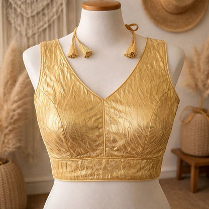 AMAB gold crush pattern soft silk blouse with padded design and tassel tie-up. Ideal for partywear.
