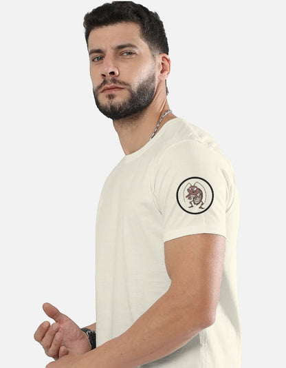AMA B Graphic Print Oversized Cotton T-Shirt in cream with a small graphic print on the left sleeve.
