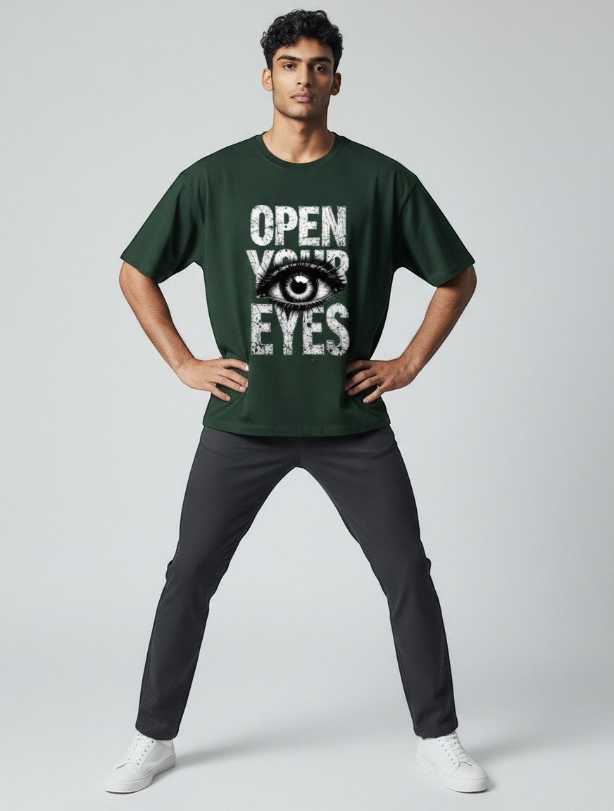 AMA B Graphic Print Oversized T-Shirt in forest green cotton with "Open Your Eyes" eye graphic.