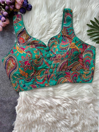 AMAB green paisley print sleeveless padded blouse with sequin embellishments and button detail.