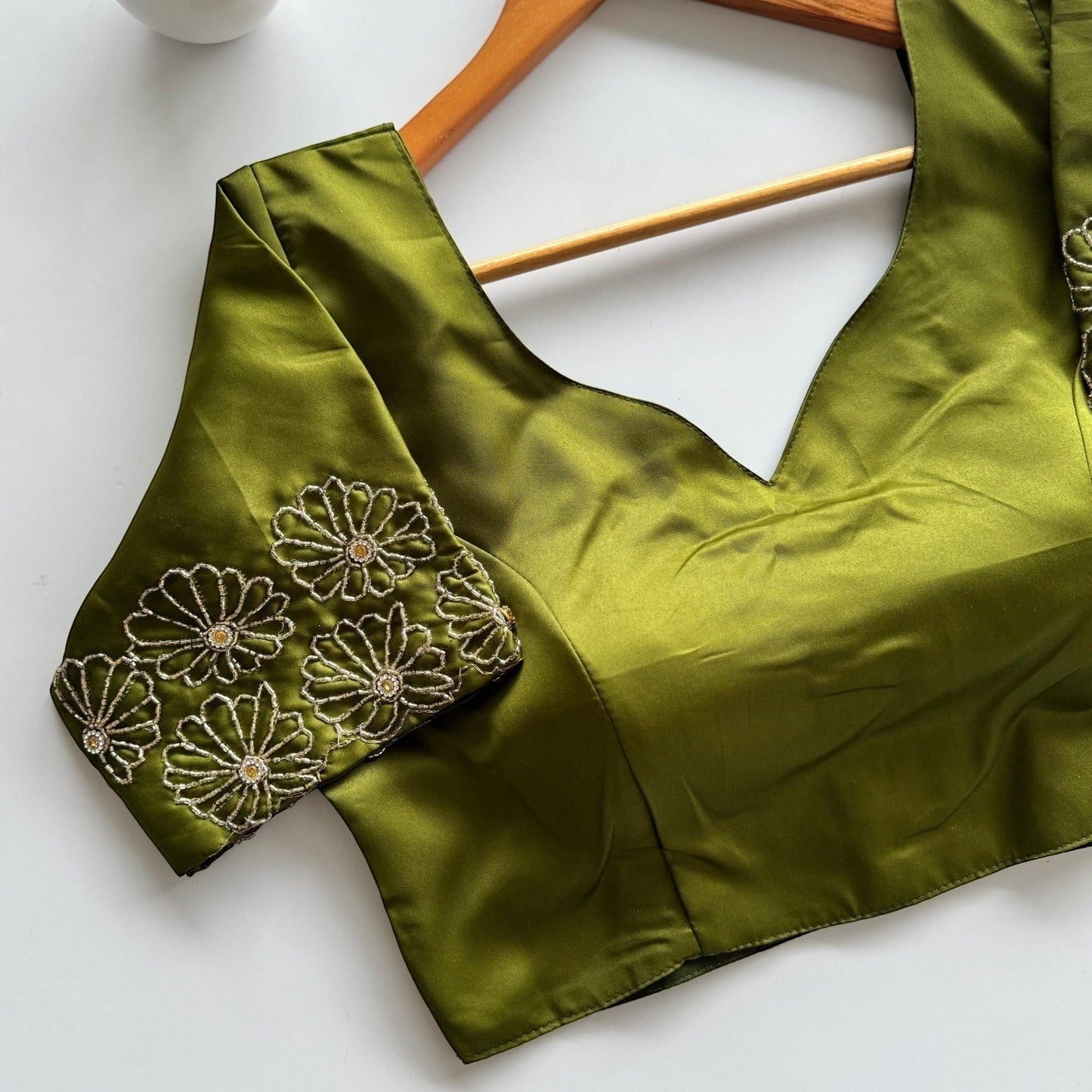 AMAB green Dilruba silk blouse with golden handwork floral embroidery on sleeves and a deep V-neck. Premium partywear.