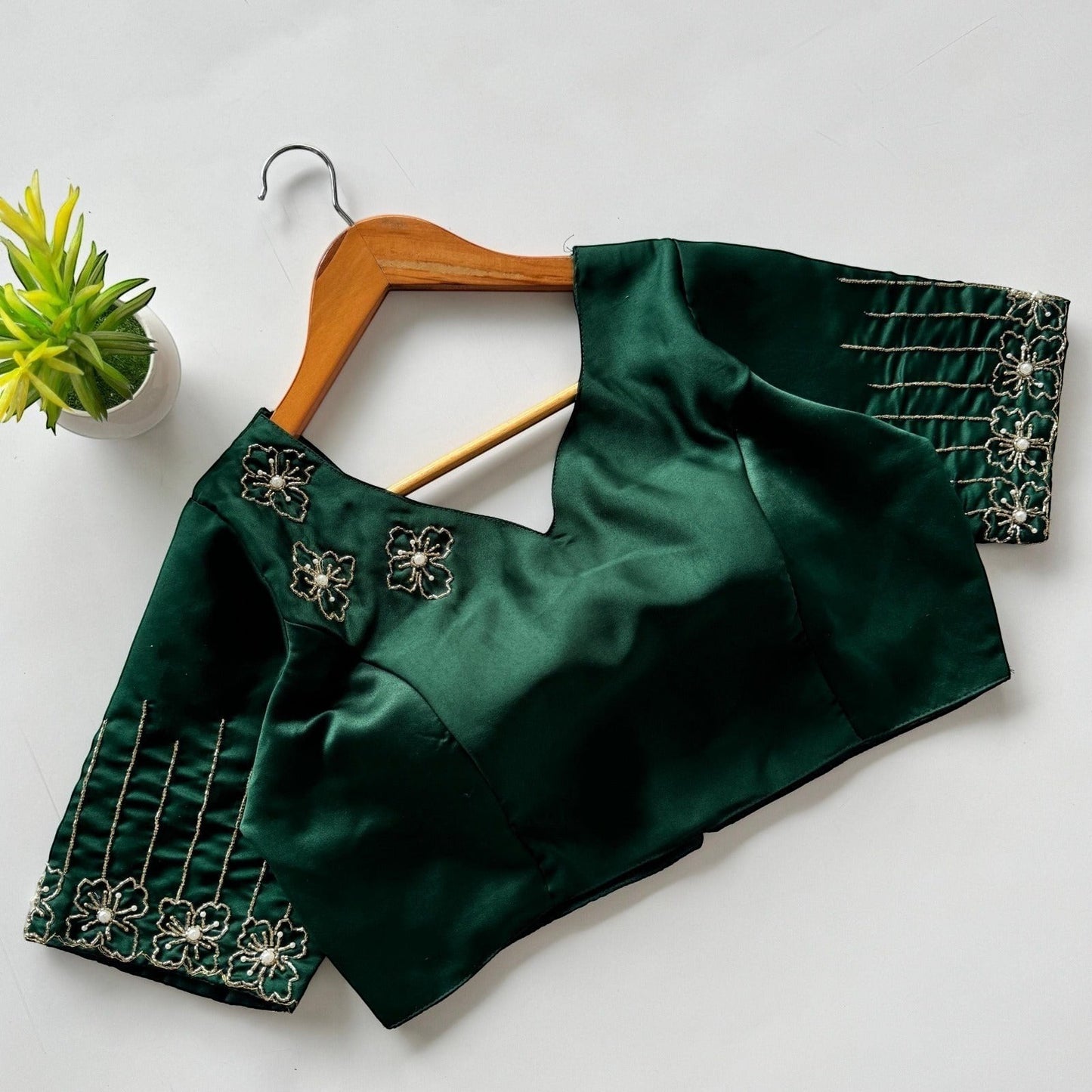 AMAB green Dilruba silk blouse with golden handwork floral embroidery on neckline and sleeves. Padded designer partywear.