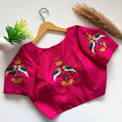 AMAB hot pink haka silk blouse with handcrafted bird embroidery on sleeves and back. Padded designer partywear.