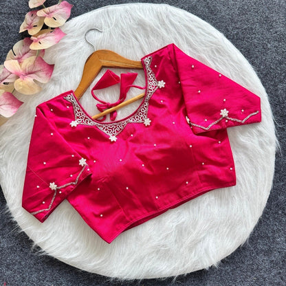 AMAB hot pink silk blouse with all-over handwork, pearl embellishments, and padded design. Features intricate neckline and sleeve detailing.