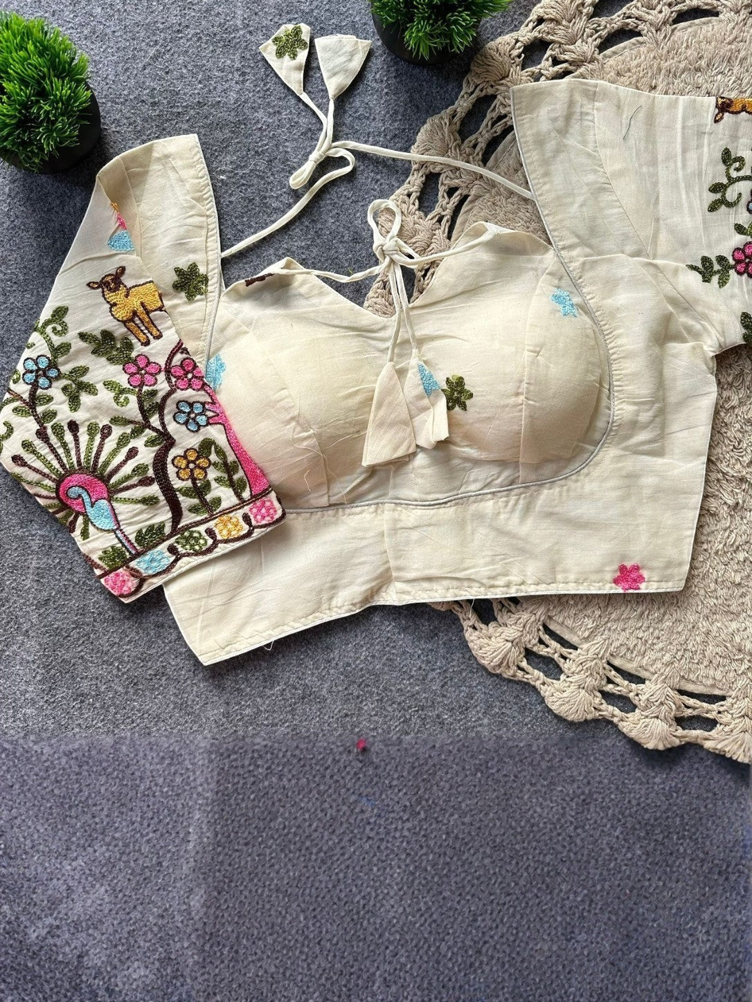 AMAB cream pure khadi cotton blouse with colorful embroidery on sleeves and front, padded, back open design.