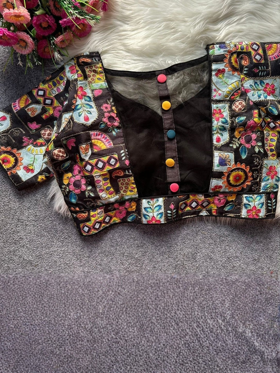 AMAB black Malai silk blouse with colorful patchwork print, sheer neckline, and decorative buttons. Front open design.