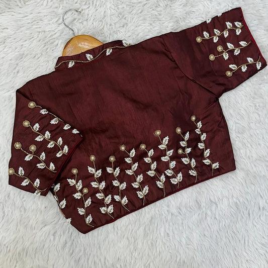 AMAB designer maroon silk blouse with white and gold floral embroidery on collar, sleeves, and hem. Padded fit.