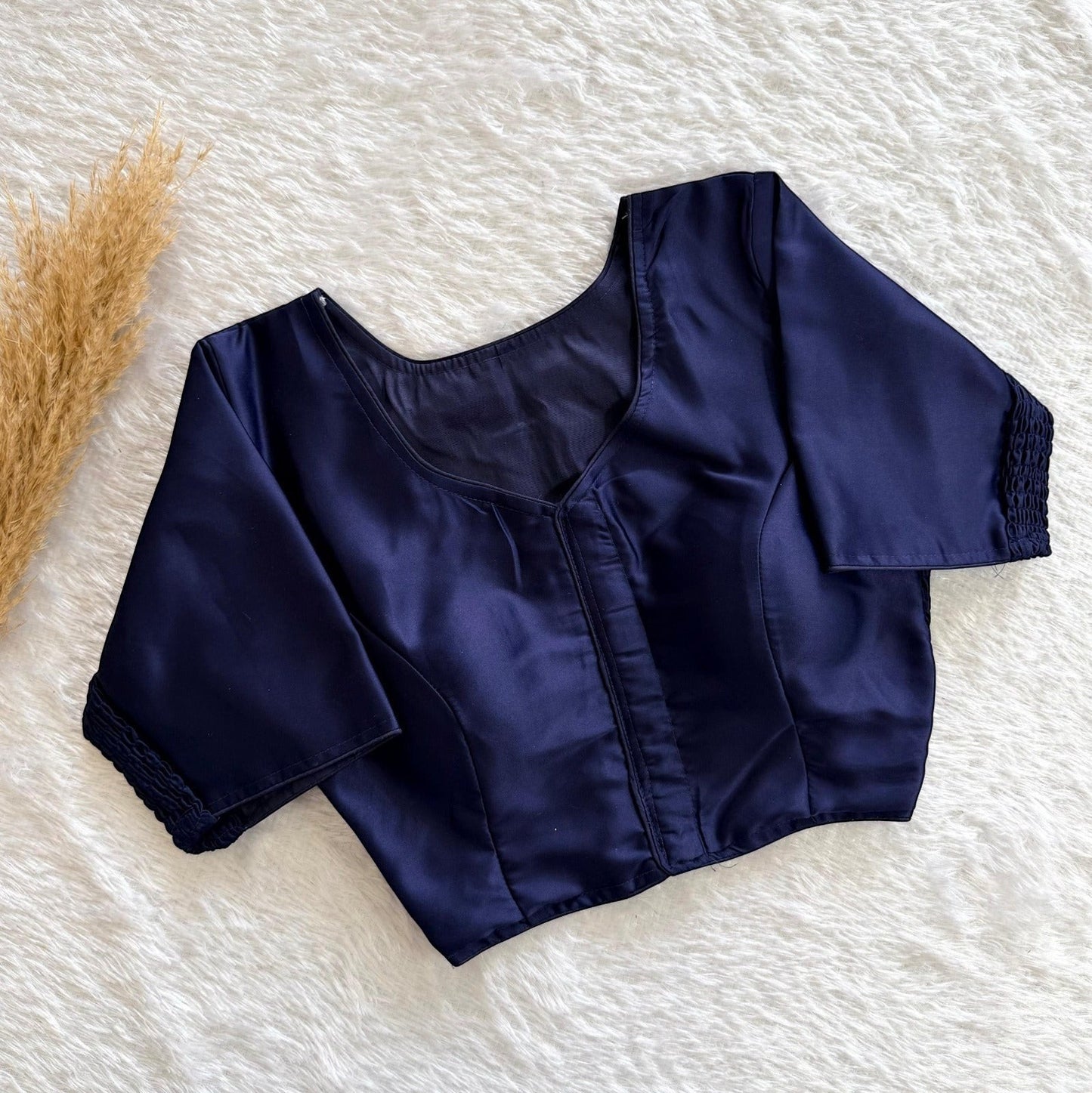 AMAB navy blue pure silk padded designer blouse with elastic fit and decorative sleeve cuffs.