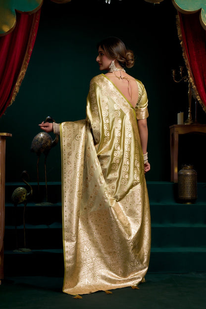 AMAB olive green silk blend saree with gold zari weaving and traditional motifs, featuring a rich pallu and border.