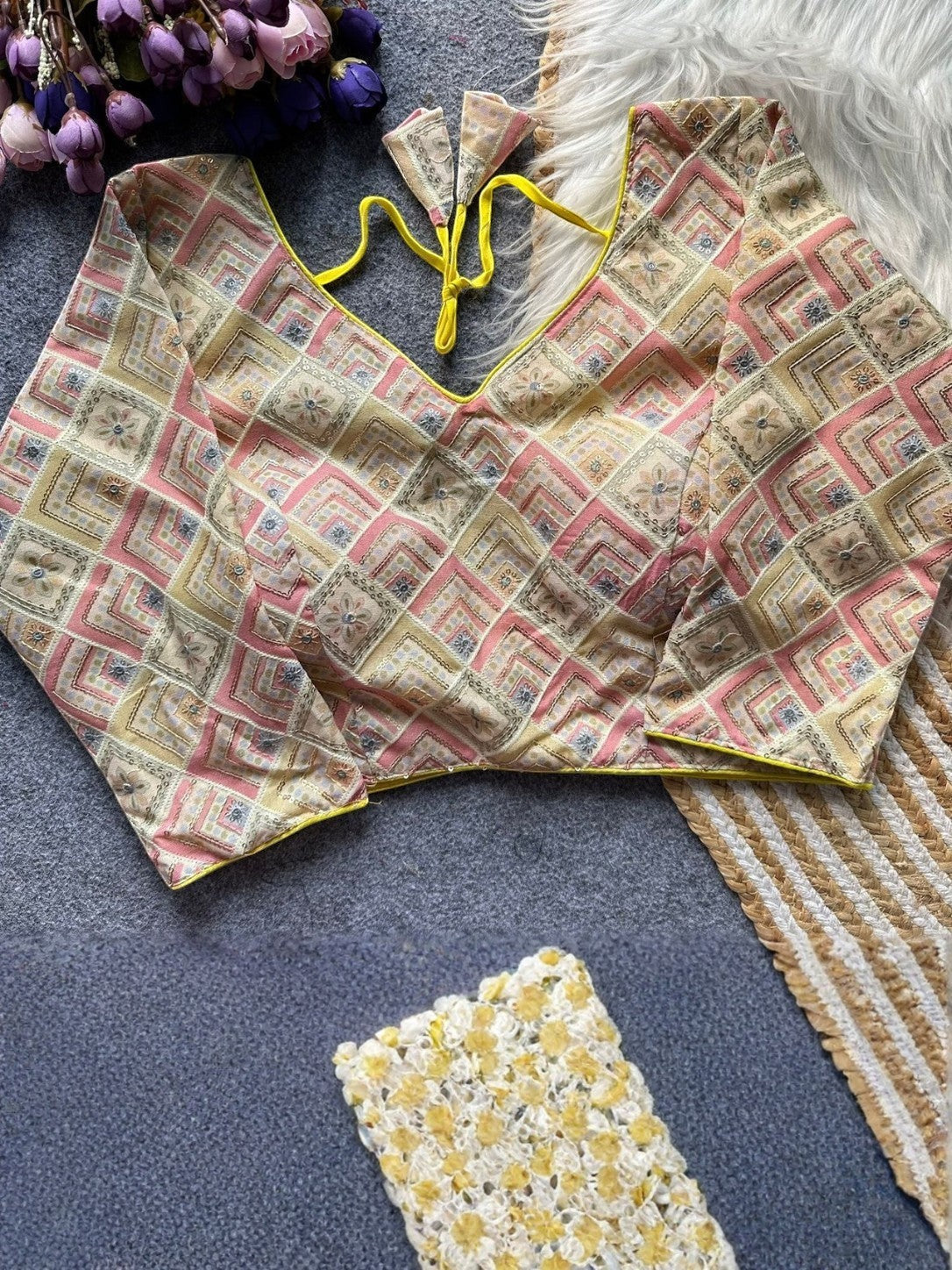 AMAB designer printed blouse with yellow trim and tie closure. Features a geometric diamond pattern in pink, beige, and blue.