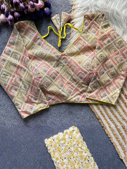 AMAB designer printed blouse with yellow trim and tie closure. Features a geometric diamond pattern in pink, beige, and blue.