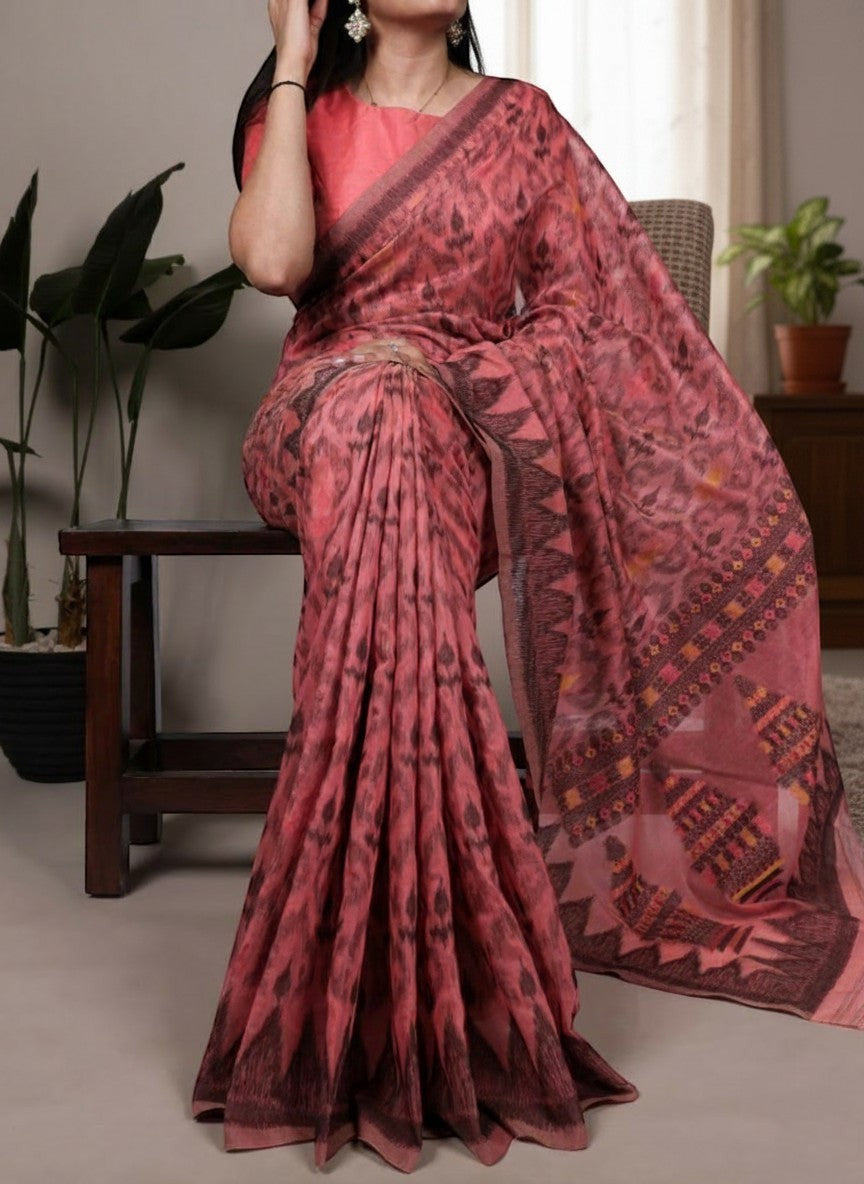 AMAB pink cotton saree with all-over abstract print and patterned border, includes blouse piece.