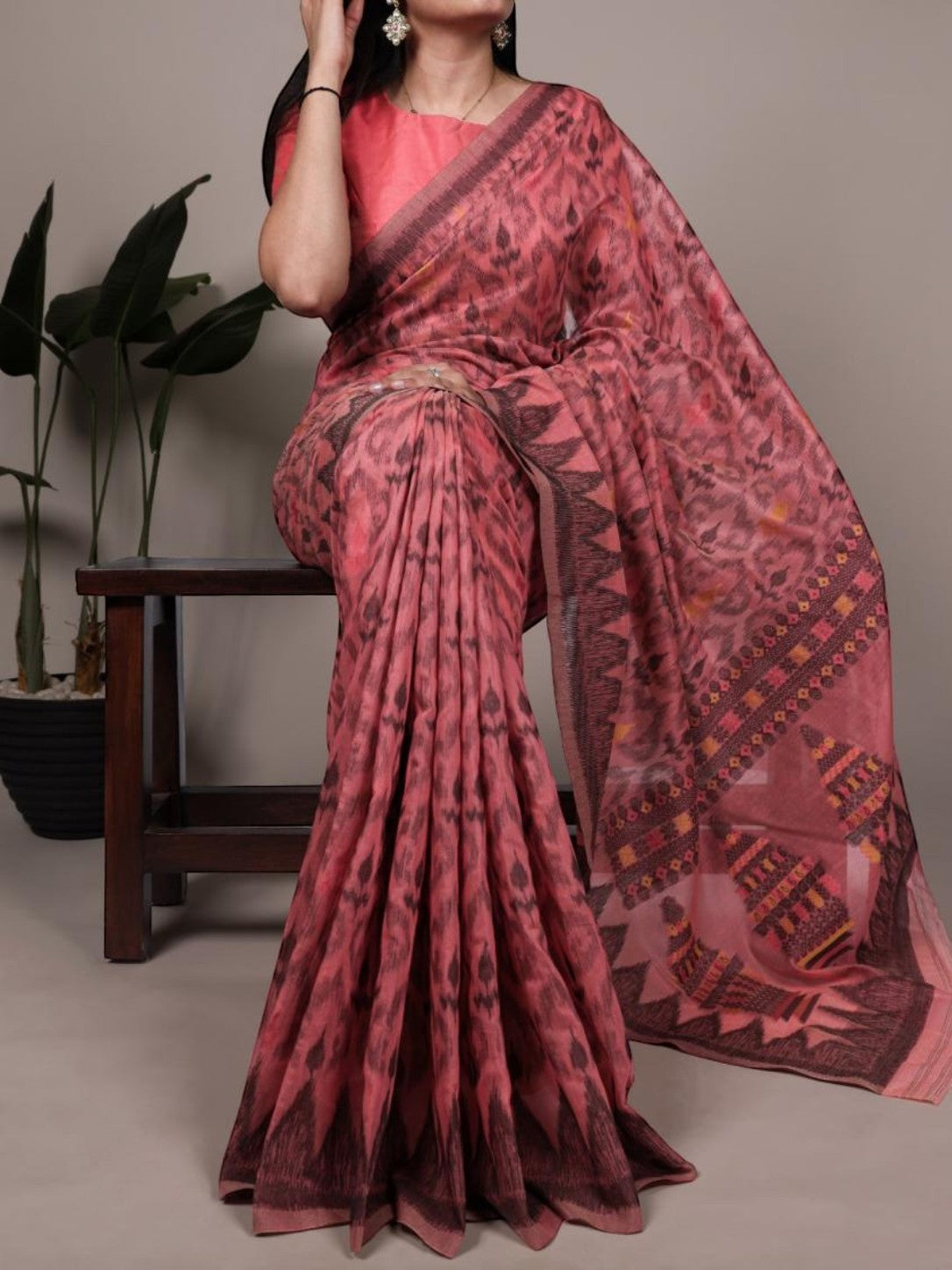 AMAB pink cotton saree with all-over ikat-style print and embroidered border, includes blouse piece.