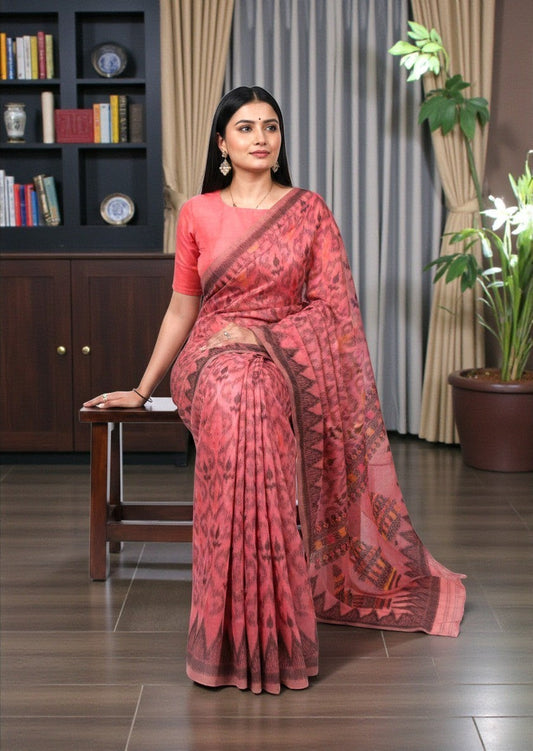 AMAB pink cotton saree with all-over ikat-style print and dark border. Includes matching blouse piece.