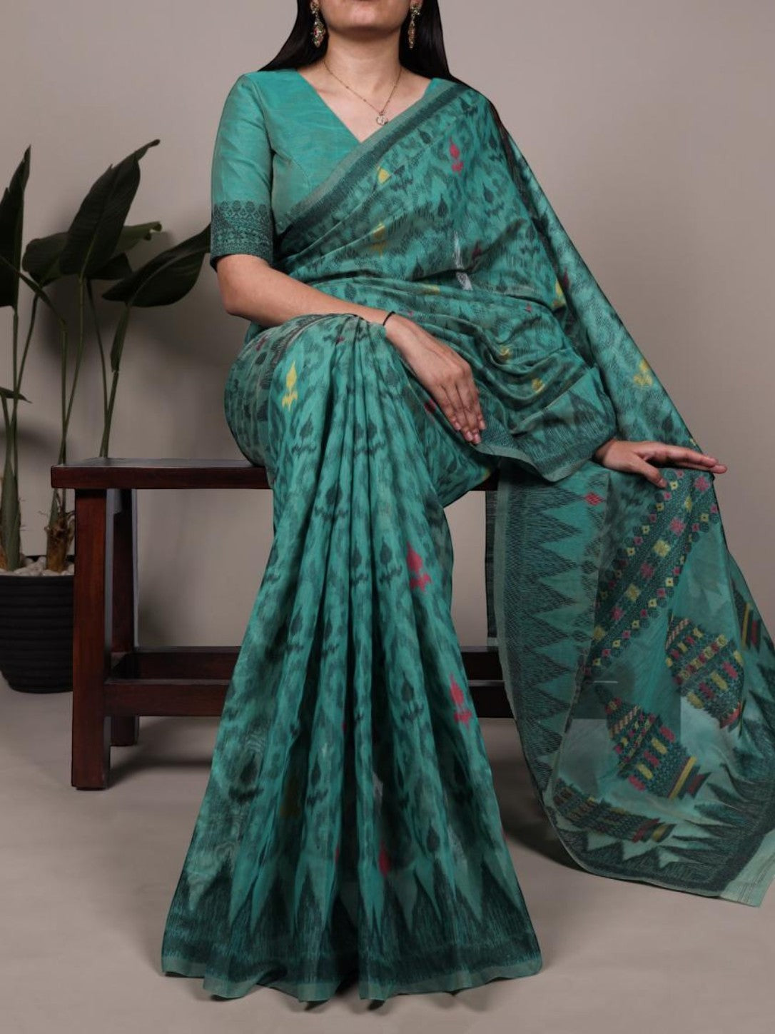 AMAB teal green printed cotton saree with blouse piece, featuring intricate traditional and contemporary motifs. Lightweight and comfortable for any occasion.