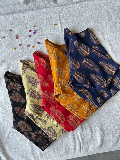 AMAB Pure Ajrakh handblock cotton blouses in black, cream, red, yellow, and navy blue with feather print. Princess cut, boat neck.