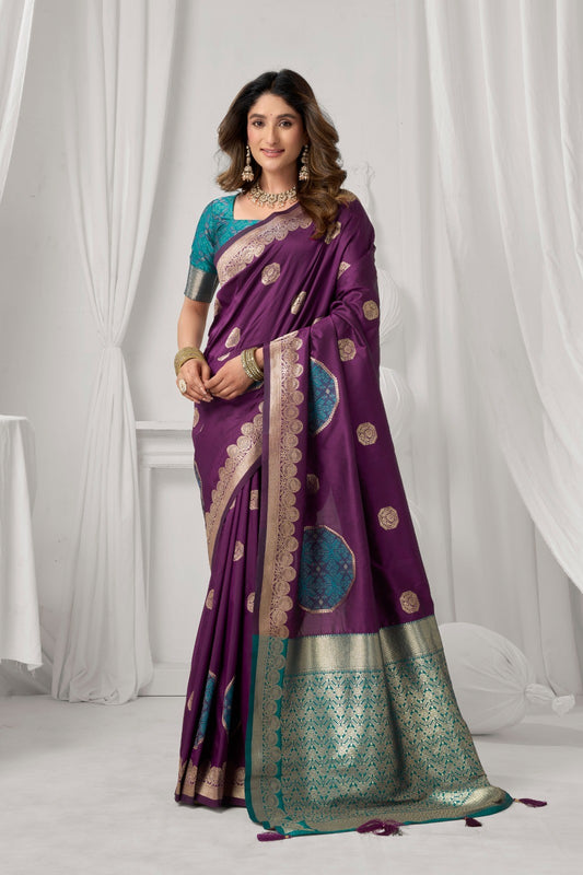 AMAB purple Kanjeevaram silk saree with gold and teal intricate border and circular motifs. Model wears teal blouse.