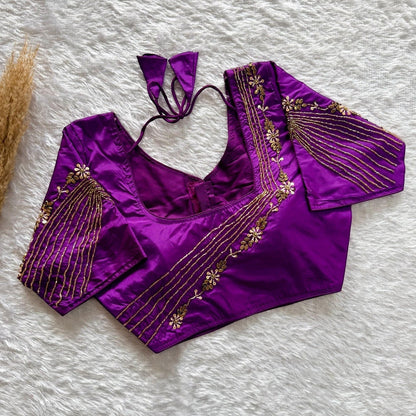 AMAB designer purple soft silk blouse with heavy gold handwork on sleeves and back, padded, ready for party wear.