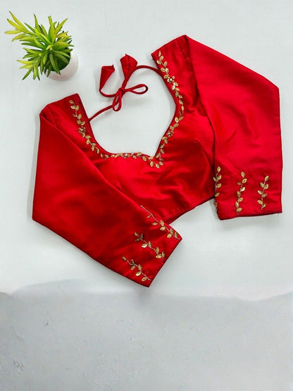 AMAB red silk designer blouse with golden handwork and sequence detailing on neckline and sleeves. Padded with 3/4 sleeves.