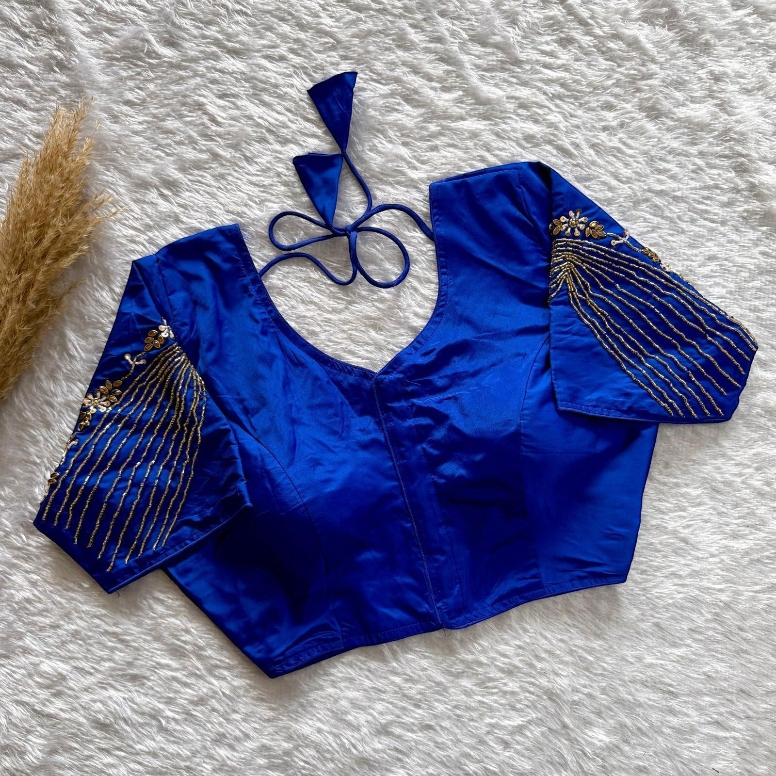 AMAB royal blue soft silk partywear blouse with heavy handwork on sleeves and back, v-neck, padded, tie-up closure.