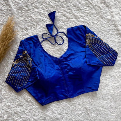 AMAB royal blue soft silk partywear blouse with heavy handwork on sleeves and back, v-neck, padded, tie-up closure.