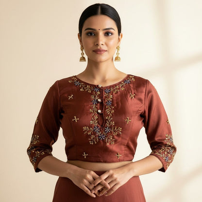AMAB designer rust butter silk blouse with intricate handwork embroidery on neckline and sleeves. Padded partywear.